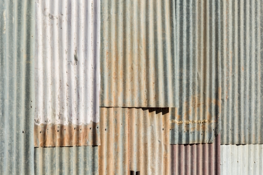 Old sheets of corrugated iron on a wall - Australian Stock Image