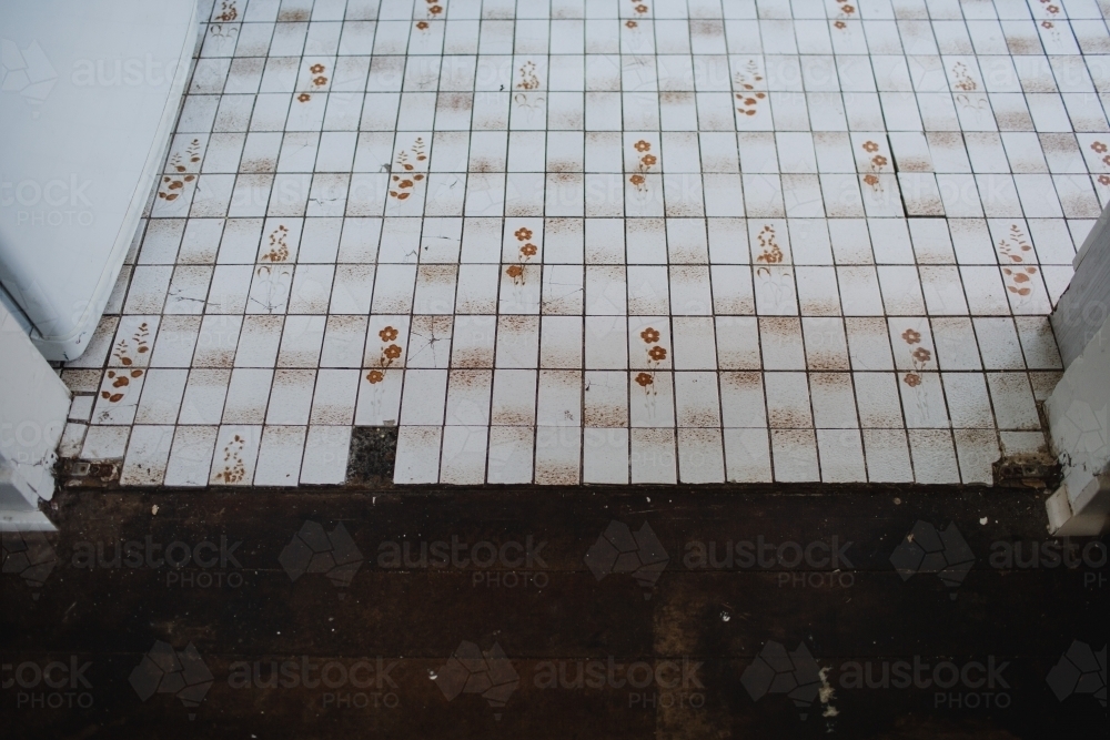 Old tile floor in bathroom - Australian Stock Image