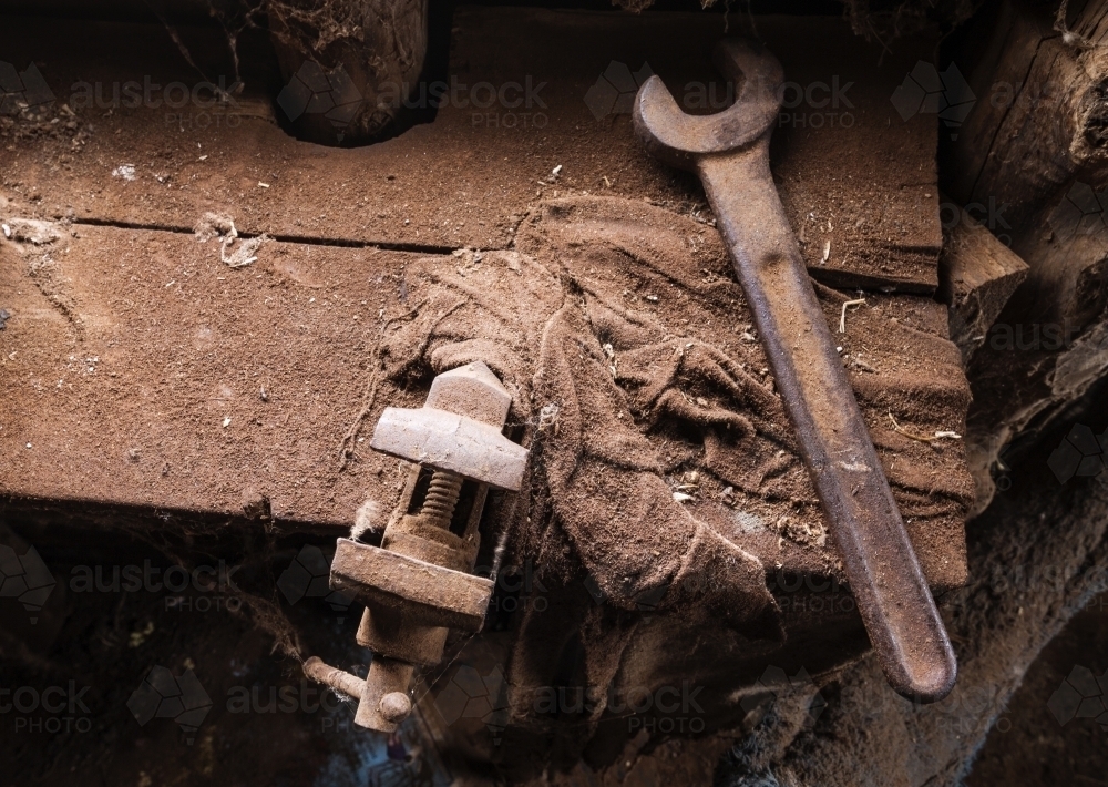 Old tools on a dusty bench looking from above - Australian Stock Image