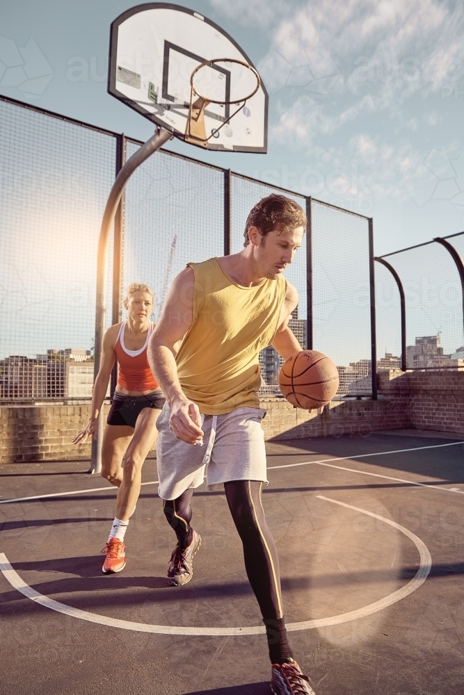 One on one basketball dribble - Australian Stock Image