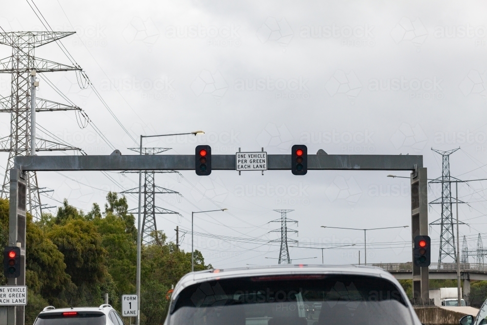 One vehicle per green each lane sign with lights - Australian Stock Image