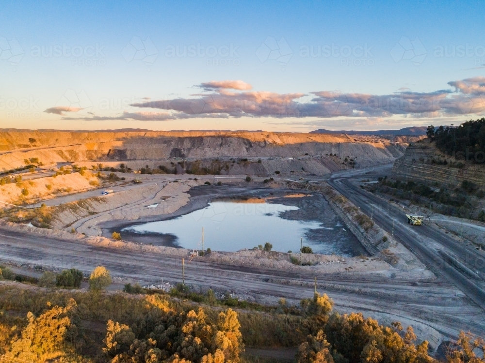 open cut coal mine in Bulga area of the Hunter Valley in the evening - Australian Stock Image