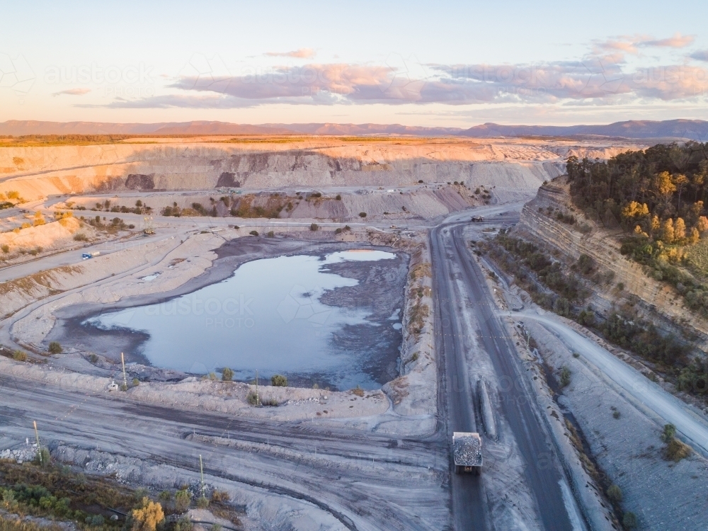 open cut coal mine in Bulga area of the Hunter Valley in the evening - Australian Stock Image