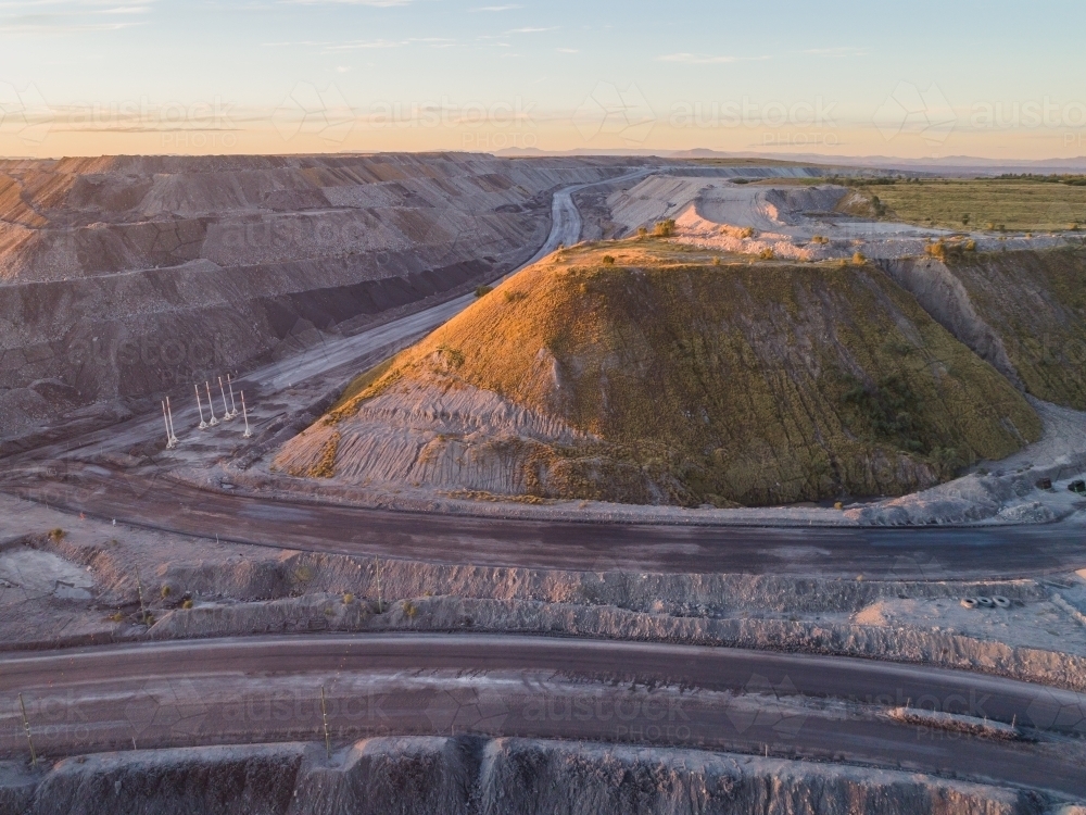 open cut coal mine in Bulga area of the Hunter Valley in the evening - Australian Stock Image