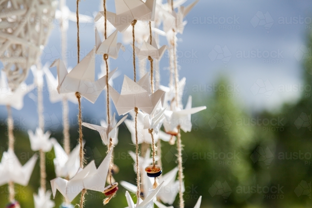 Origami cranes on string decoration - Australian Stock Image