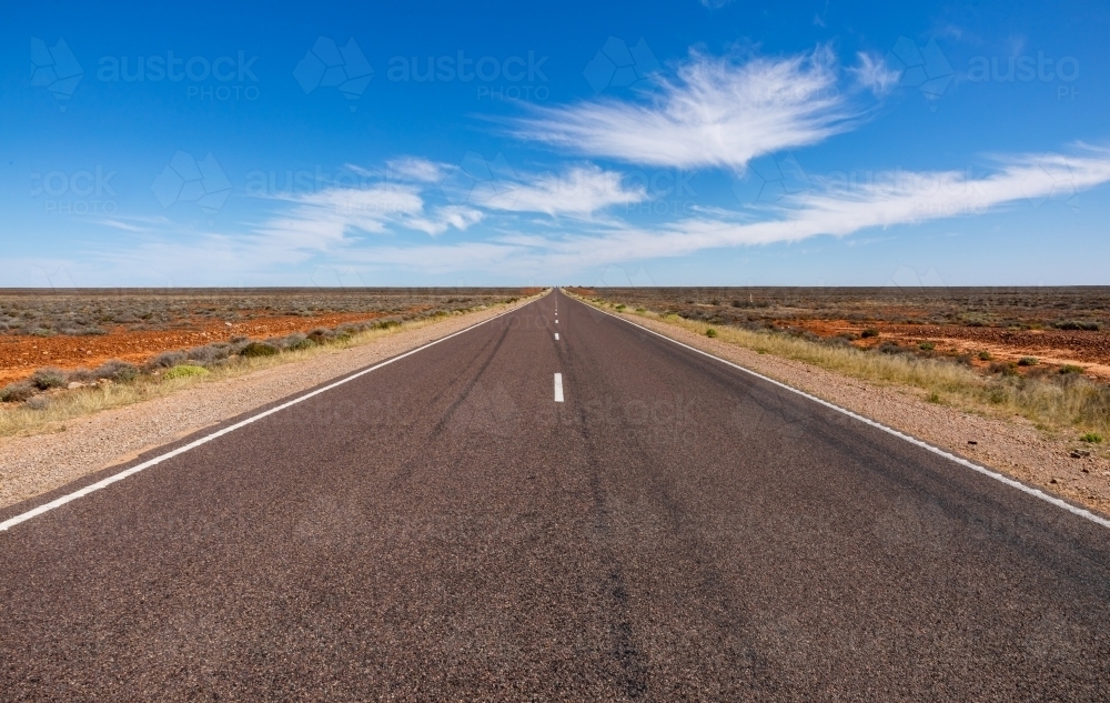 outback road disappearing in the distance - Australian Stock Image