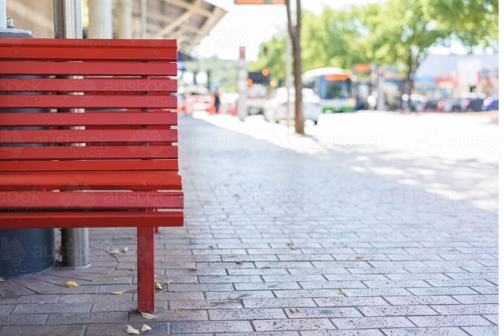 Outdoor red wooden benches - Australian Stock Image