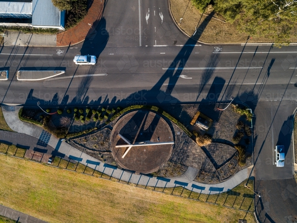 Overhead aerial top down view of Singletons sundial with shadow falling across road - Australian Stock Image