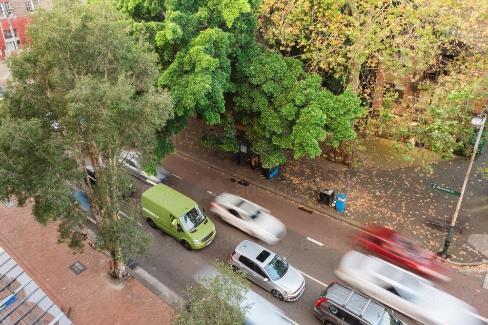 overhead of moving traffic on city street - Australian Stock Image