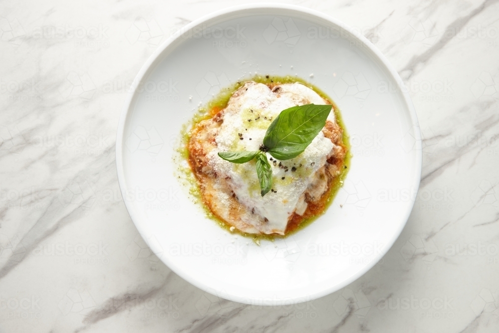 Overhead shot of cheesy Italian pasta dish - Australian Stock Image