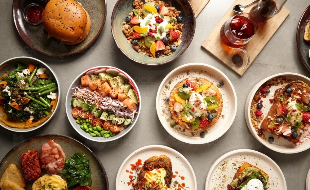 Overhead shot of multiple food dishes on table - Australian Stock Image