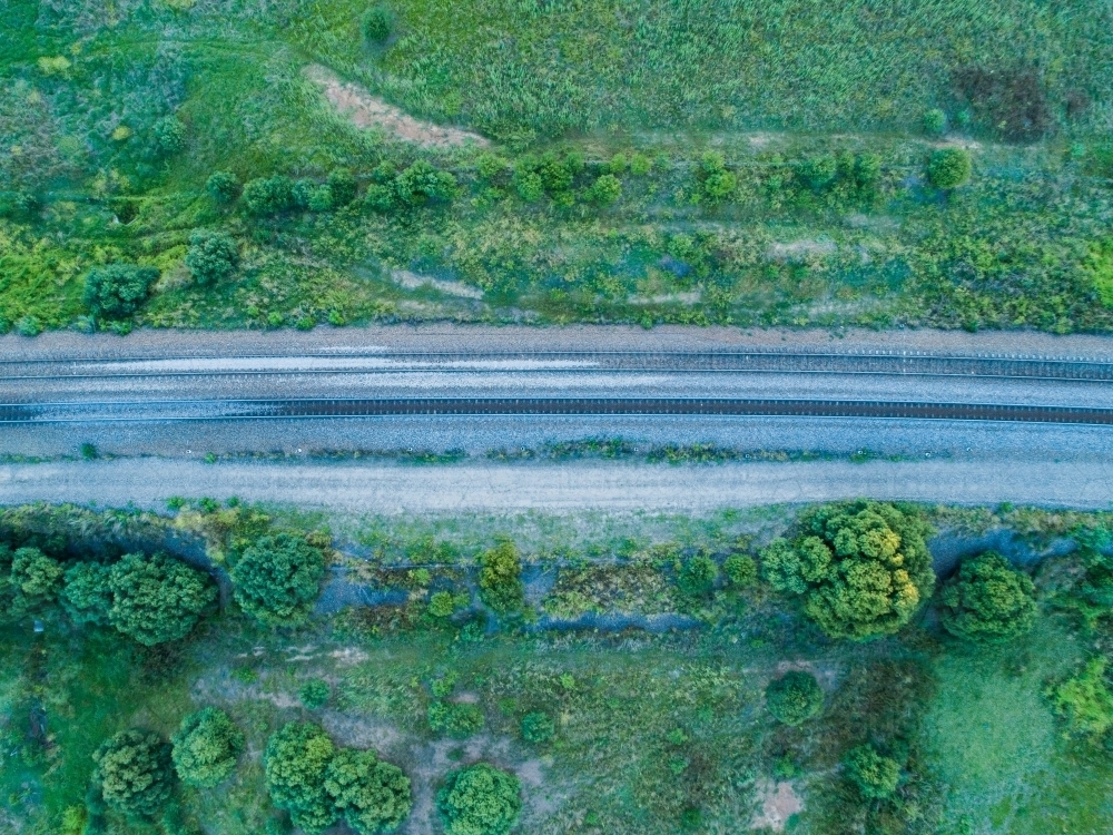 Overhead top down of empty railway track in countryside - Australian Stock Image