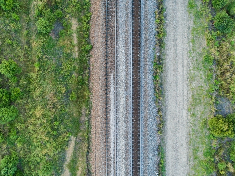 Overhead top down of empty railway track in countryside - Australian Stock Image