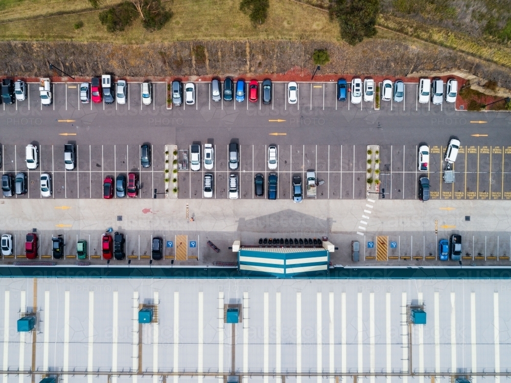 overhead view of customers parking in carpark beside hardware store - Australian Stock Image