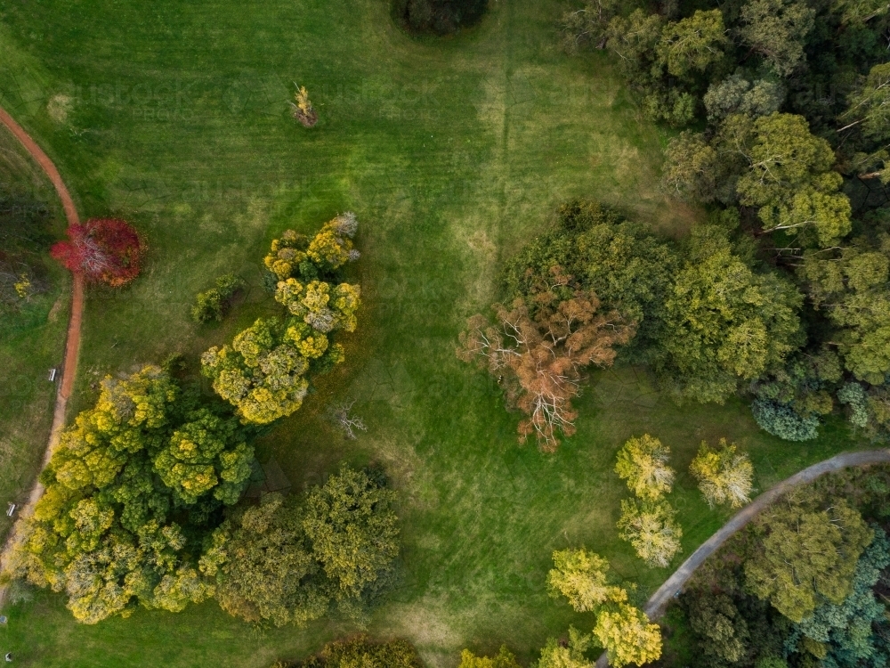 Overhead view of green parkland space with walking paths - Australian Stock Image