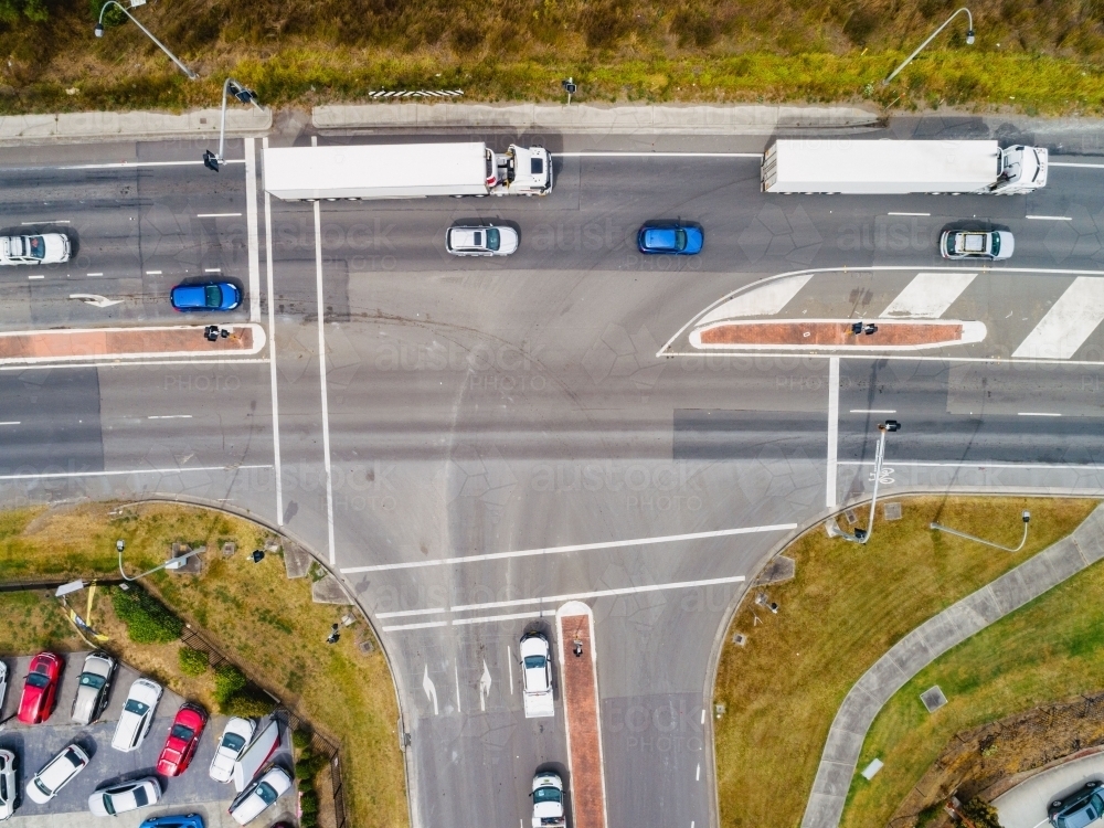 Overhead view of intersection with trucks and cars on highway - Australian Stock Image