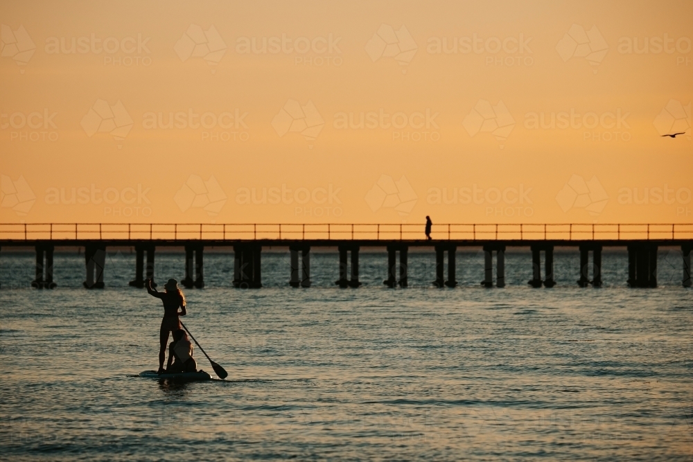 Paddle board at sunset - Australian Stock Image