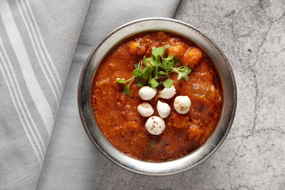 Paneer makhana curry dish on table - Australian Stock Image