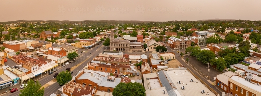 Panoramic aerial view of a dust cloud over a country town - Australian Stock Image