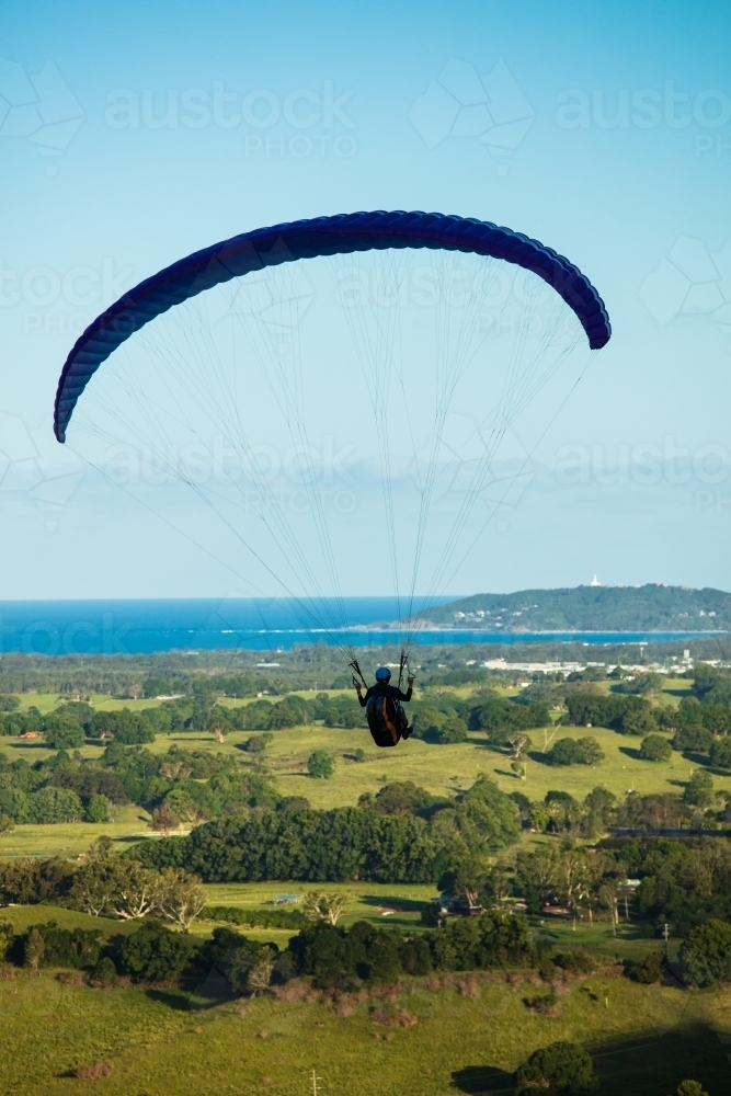 Paragliding above the hinterland near Byron Bay in the Northern Rivers. - Australian Stock Image