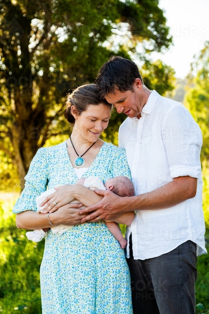 Parents holding newborn child together month old baby - Australian Stock Image