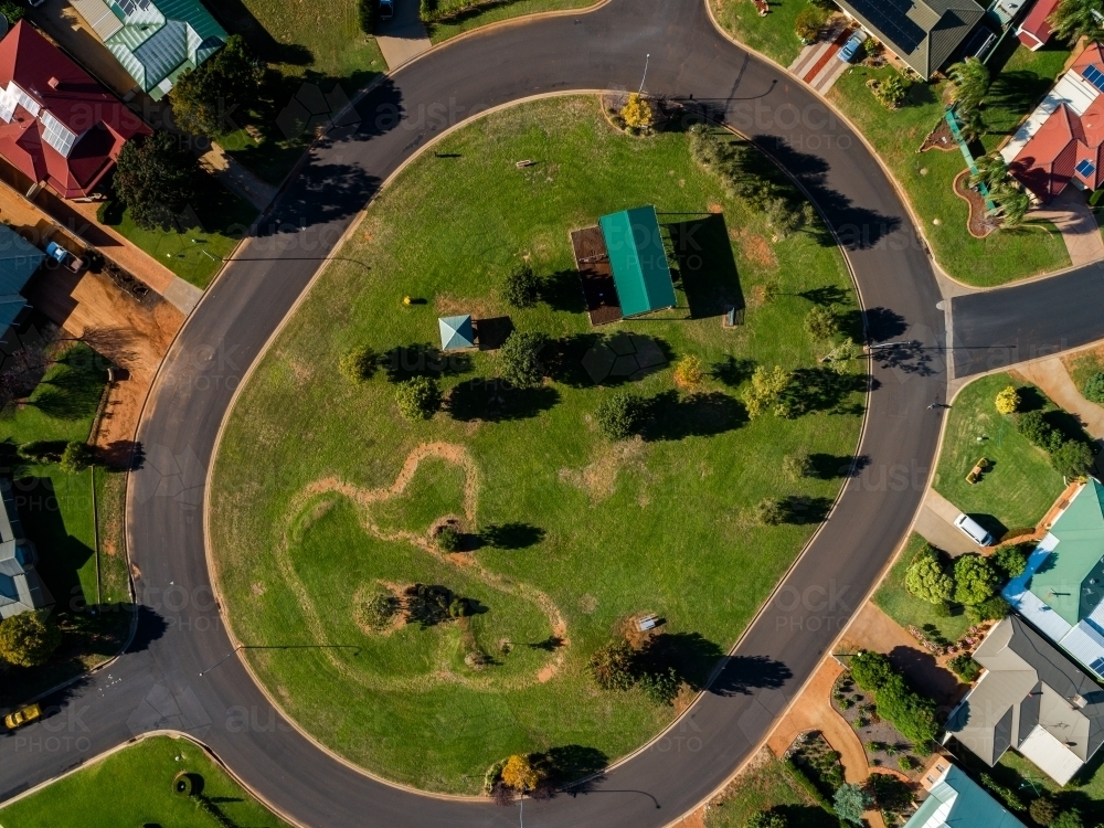 Park and playground in the center of streets and homes seen from the air - Australian Stock Image