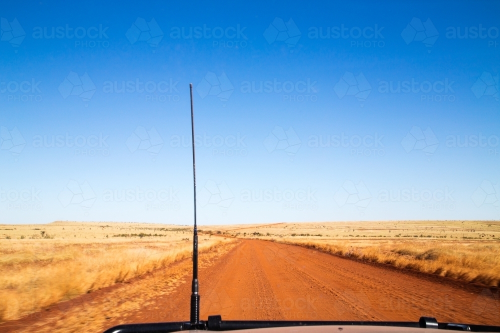 Passenger view driving on dirt road - Australian Stock Image