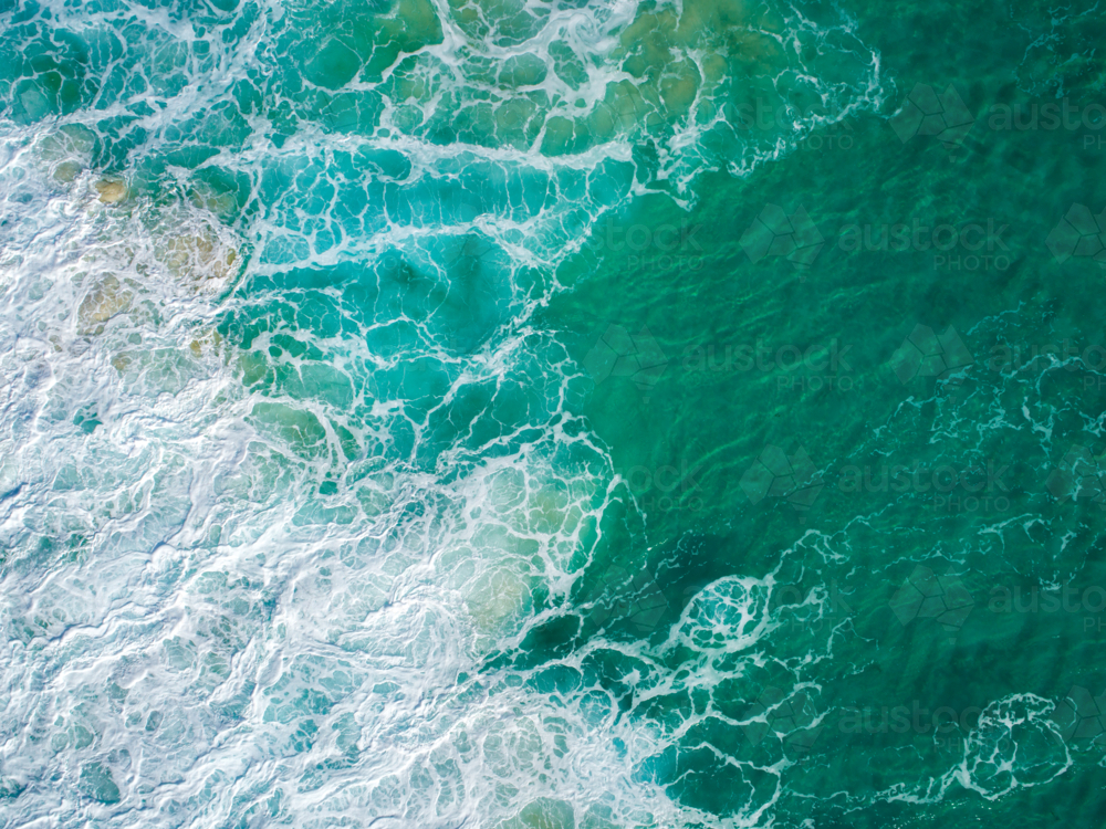 Patterns emerge in water after crashing waves disturb the surface - Australian Stock Image