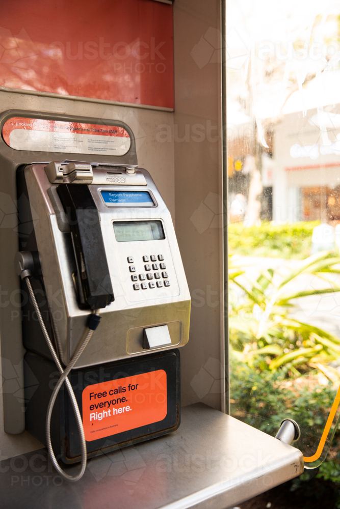 pay phone booth in a public shopping mall - Australian Stock Image