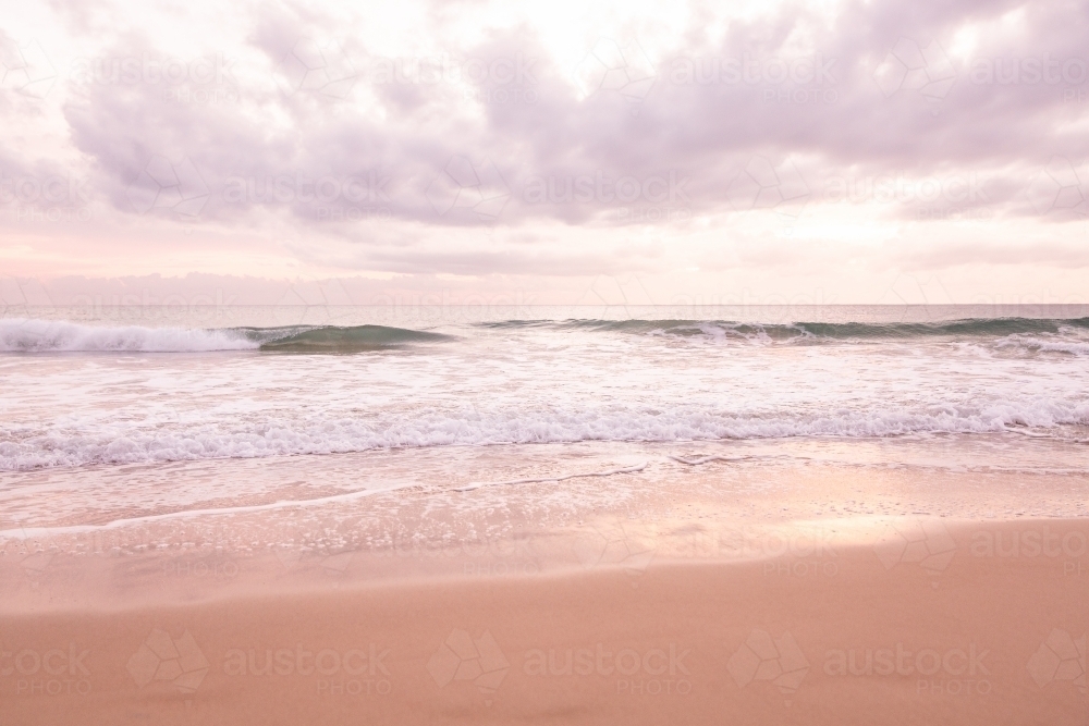 peaceful pastel sunrise over the ocean - Australian Stock Image