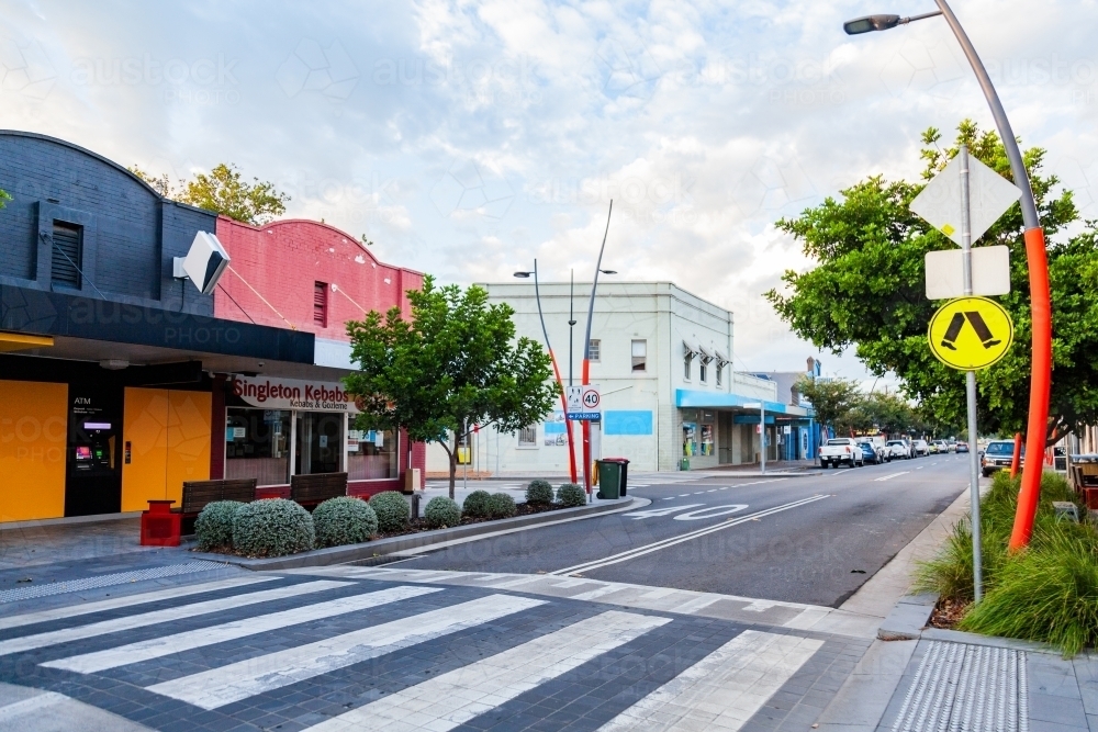 pedestrian crossing and speed hump along main street in Singleton town - Australian Stock Image