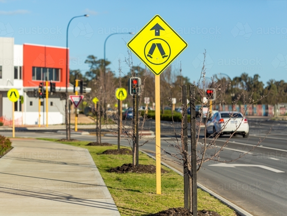 Pedestrian crossing sign on roadside - Australian Stock Image