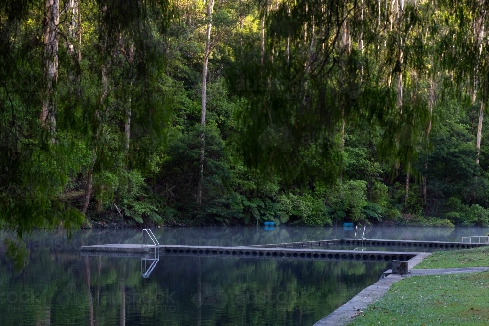 Pemberton Pool with still water reflecting trees - Australian Stock Image