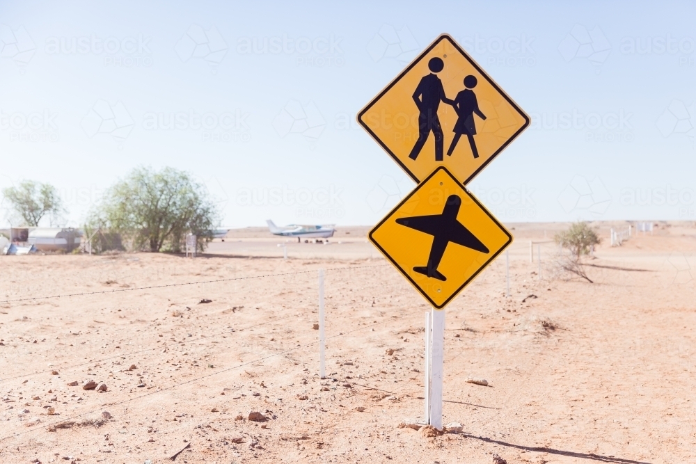 People and Plane Sign in the Outback - Australian Stock Image