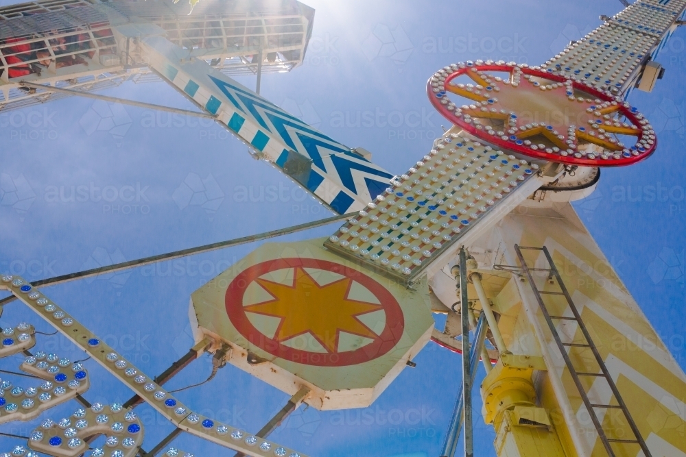 People upside down on a ride at a local show - Australian Stock Image