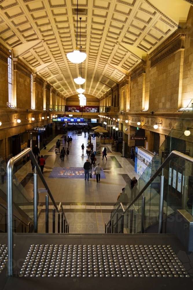 People walking through railway station - vertical - Australian Stock Image