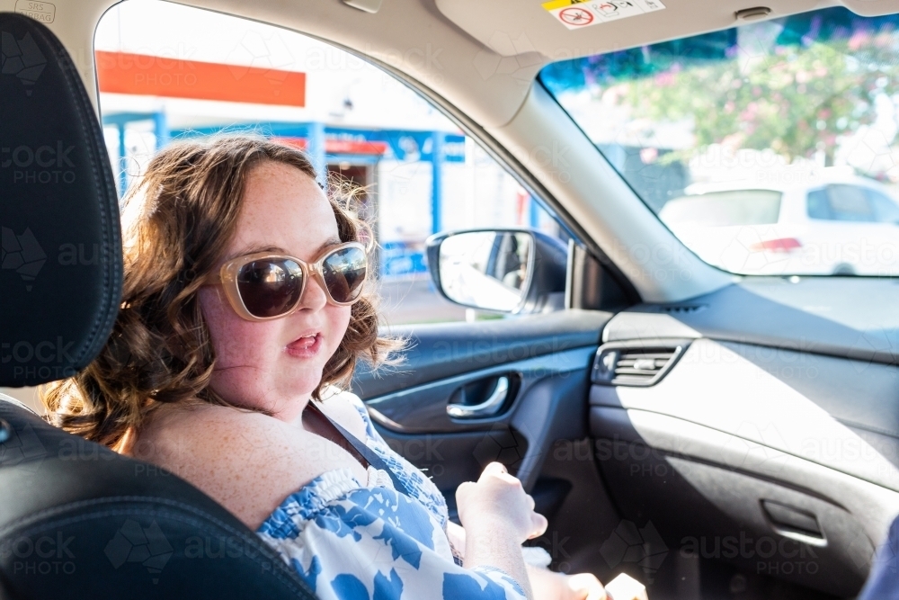 Person with a disability travelling in a car NDIS Provider helping with access to community - Australian Stock Image