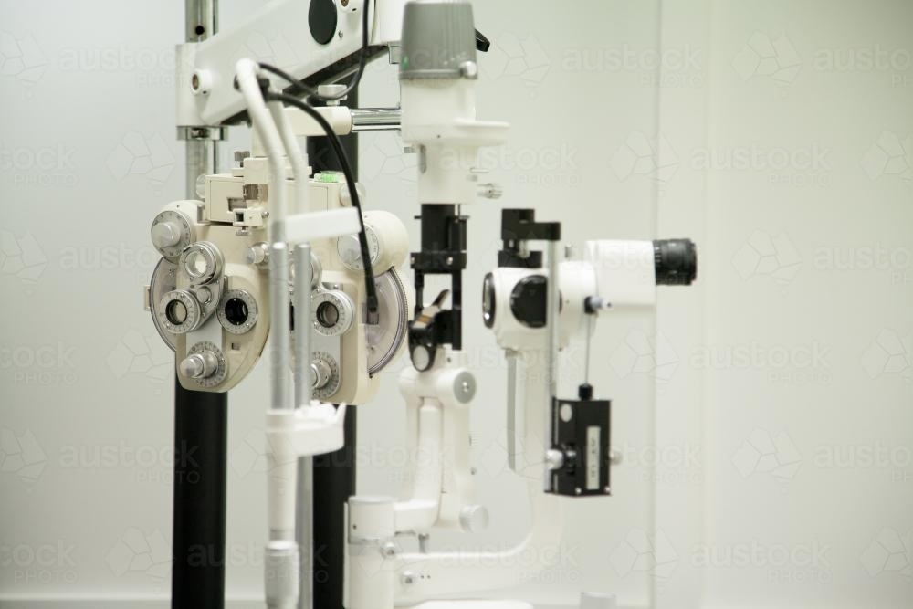 Phoropter and other eye testing machines in optometrist's room - Australian Stock Image