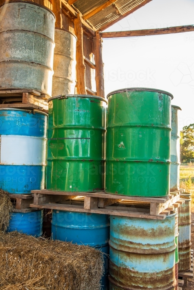 Pile of drums on a farm - Australian Stock Image