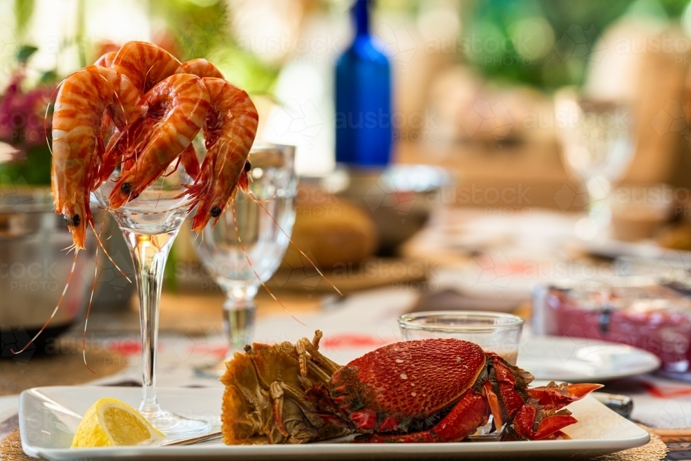 plate of seafood on a table set for a celebration meal - Australian Stock Image