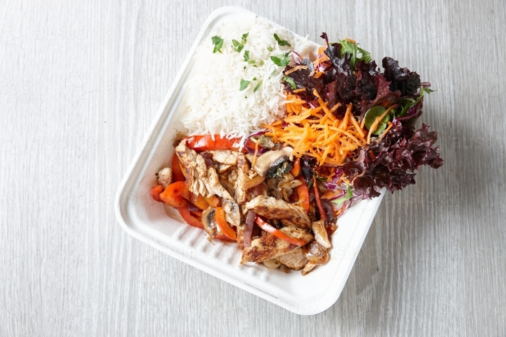 Polystyrene plate of chicken, rice and vegetables - Australian Stock Image