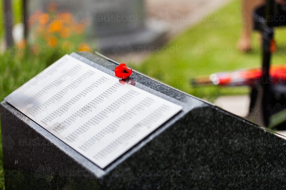 Poppy flower on WW2 memorial plinth on remembrance day in Singleton - Australian Stock Image