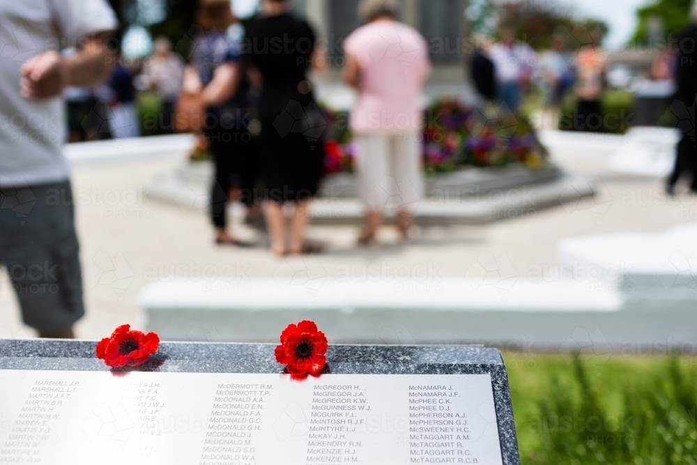 Poppy flower on WW2 memorial plinth on remembrance day in Singleton - Australian Stock Image