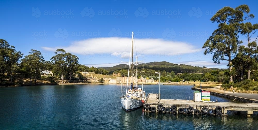 Port Arthur Jetty and sailing boat. - Australian Stock Image