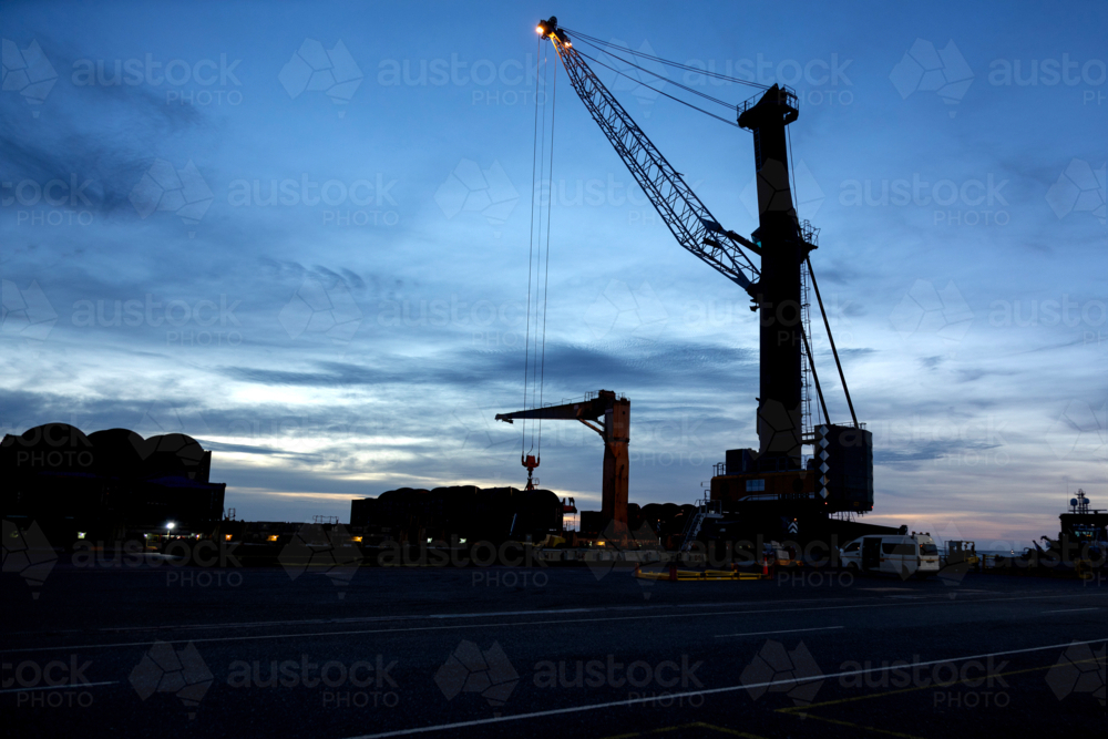 Port in silhouette with crane - Australian Stock Image