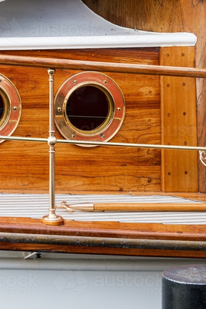 Porthole and railings on wooden boat - Australian Stock Image