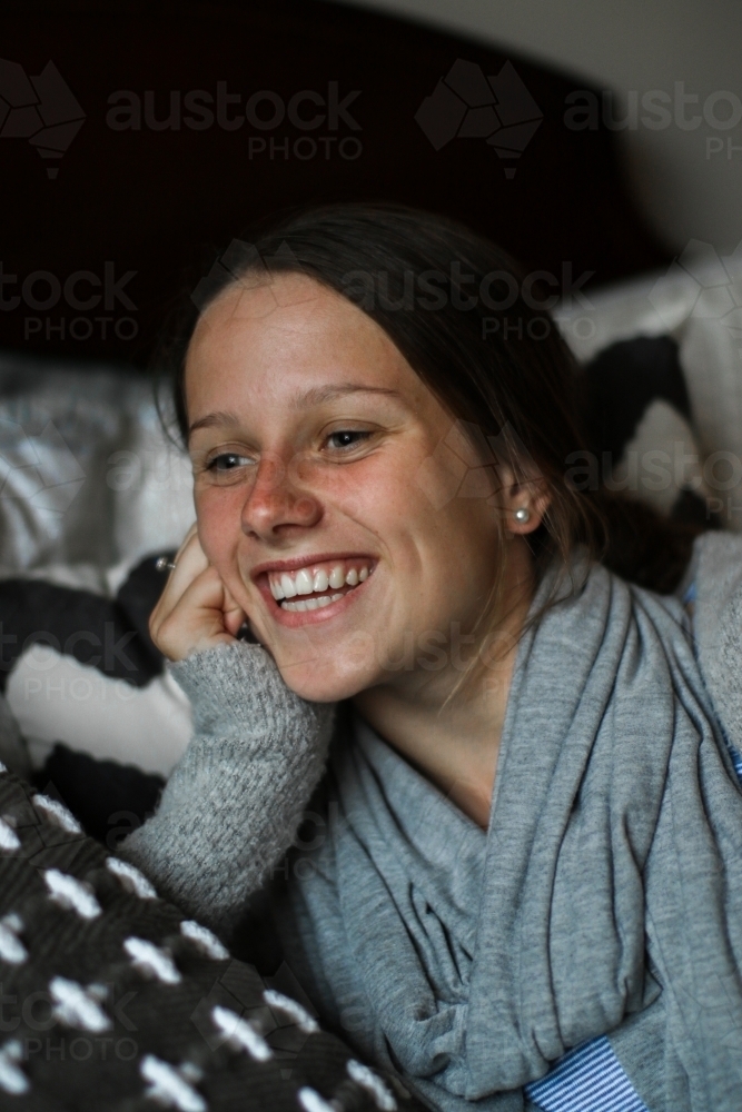 Portrait of a happy young teenage girl indoors - Australian Stock Image