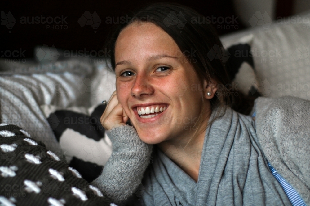 Portrait of a happy young teenage girl indoors - Australian Stock Image