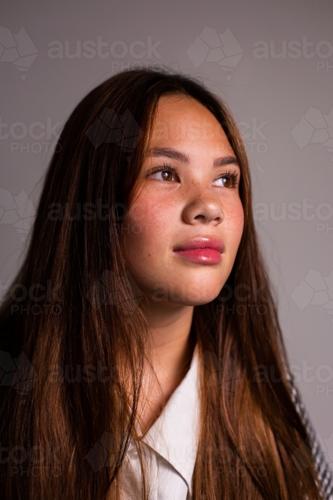 portrait of a teen girl looking to the side - Australian Stock Image