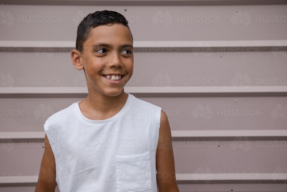 Portrait of a young, smiling first nations boy - Australian Stock Image